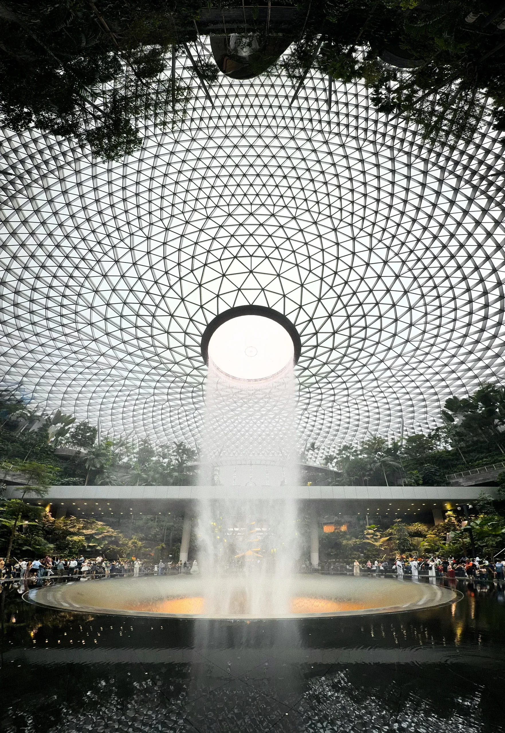 The Rain Vortex beneath the geometric glass roof at Jewel Changi Airport